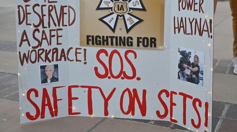 A sign calling for better safety on movie sets during a vigil held to honor cinematographer Halyna Hutchins at Albuquerque Civic Plaza on Oct. 23, 2021, in Albuquerque, New Mexico. Hutchins was killed on set while filming the movie "Rust" at Bonanza Creek Ranch near Santa Fe, New Mexico, on Oct. 21, 2021. The film's star and producer Alec Baldwin discharged a prop firearm that hit Hutchins and director Joel Souza. (Sam Wasson/Getty Images/TNS)