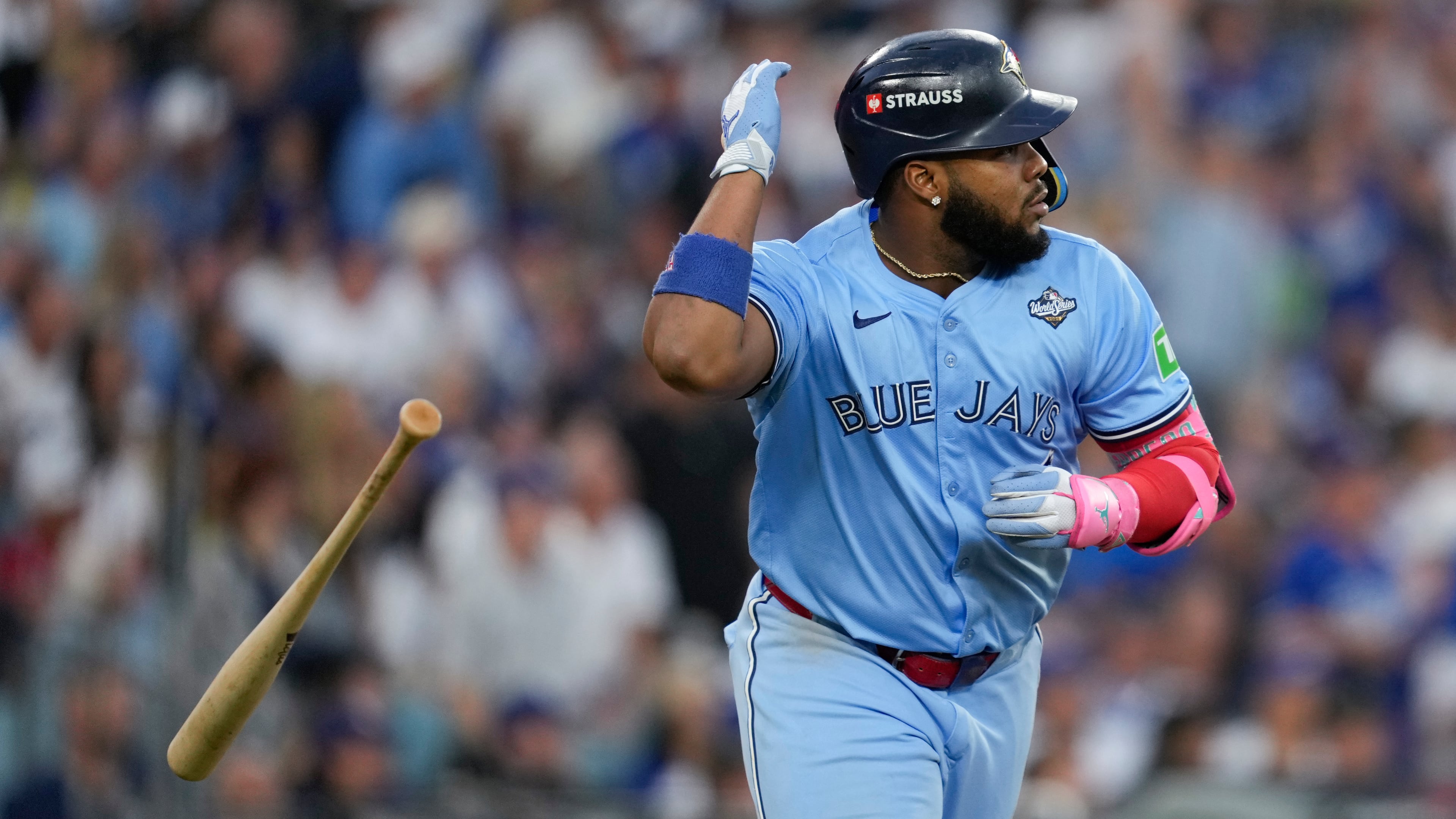 Toronto Blue Jays' Vladimir Guerrero Jr. flips his bat after hitting a two run against the Los Angeles Dodgers during the third inning in Game 4 of baseball's World Series, Tuesday, Oct. 28, 2025, in Los Angeles. (AP Photo/Ashley Landis)