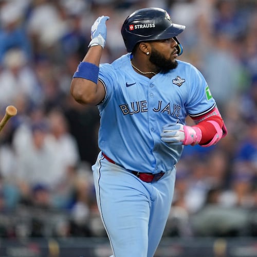 Toronto Blue Jays' Vladimir Guerrero Jr. flips his bat after hitting a two run against the Los Angeles Dodgers during the third inning in Game 4 of baseball's World Series, Tuesday, Oct. 28, 2025, in Los Angeles. (AP Photo/Ashley Landis)