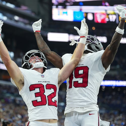 Atlanta Falcons running back Cash Jones (32) celebtes his touchdown with wide receiver Chris Blair (19) against the Indianapolis Colts during the first half of an NFL football game in Indianapolis, Saturday, Aug. 22, 2026. (AP Photo/AJ Mast)