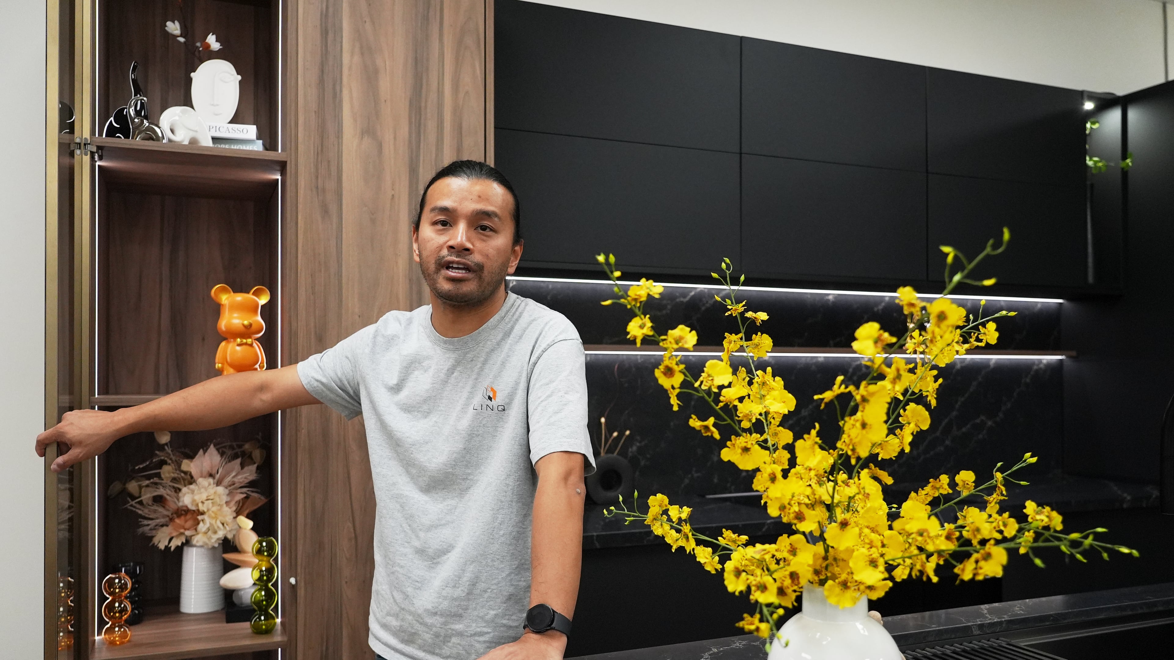 Josh Qian, co-founder of Linq Kitchen, a designer and maker of kitchen cabinets, shows his company's show room and warehouse in City of Industry, Calif., Friday, Oct. 10, 2025. (AP Photo/Damian Dovarganes)