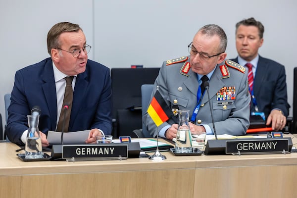 Germany's Defense Minister Boris Pistorius, left, talks as he sits next to German Inspector General of the Armed Forces Carsten Breuer during a meeting of the Ukraine Defence Contact Group at NATO headquarters in Brussels, Friday, April 11, 2025. (AP Photo/Geert Vanden Wijngaert)