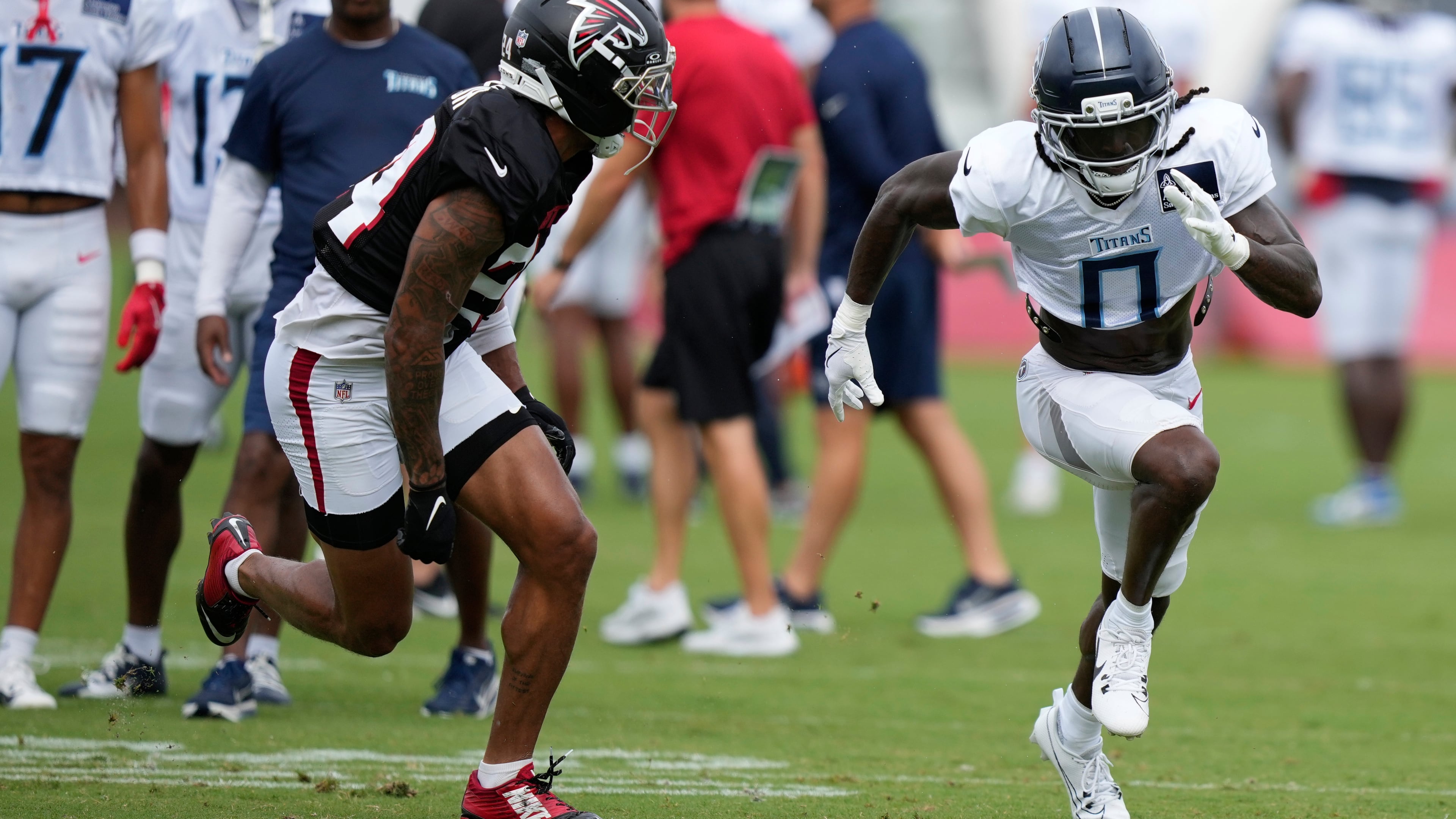 Falcons cornerback A.J. Terrell Jr. (left) covers Titans wide receiver Calvin Ridley during a joint practice Tuesday, Aug. 12, 2025, in Flowery Branch. The two were teammates in Atlanta in 2020-21. (Brynn Anderson/AP)