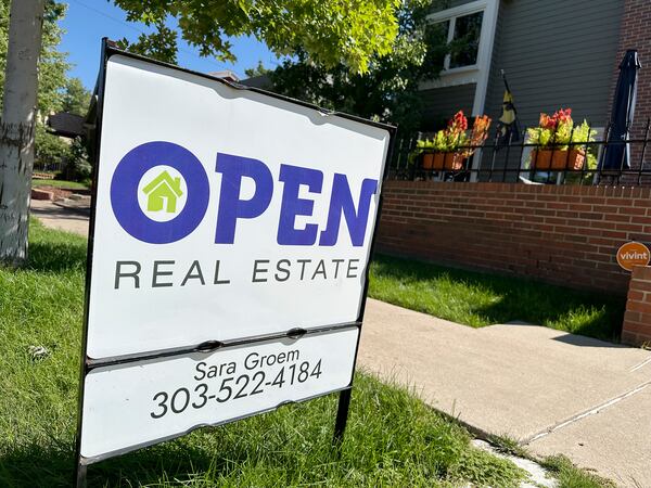 FILE - A sign stands outside a home for sale in the Alamo Placits neighborhood Tuesday, Aug. 27, 2024, in central Denver. (AP Photo/David Zalubowski, File)