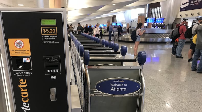 Luggage carts at Hartsfield-Jackson KELLY YAMANOUCHI / AJC