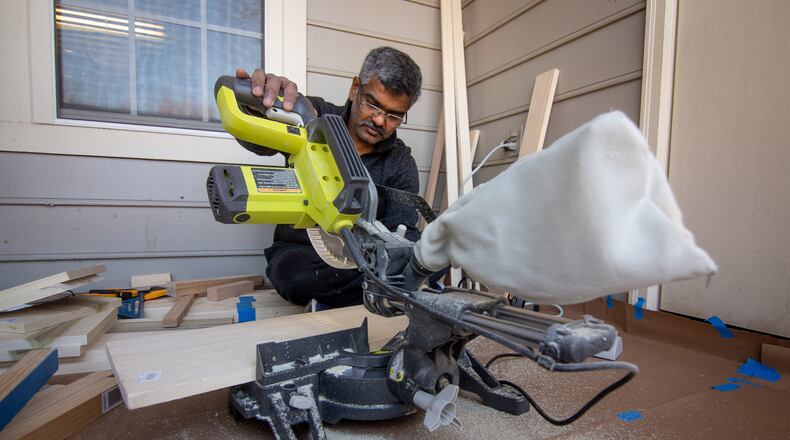 Anil Joseph works on a side table for his daughter at his Marietta home. He is part of a wave of metro Atlantans who launched into hobbies during the pandemic. Many got more than what they expected out of it. (STEVE SCHAEFER FOR THE ATLANTA JOURNAL-CONSTITUTION)