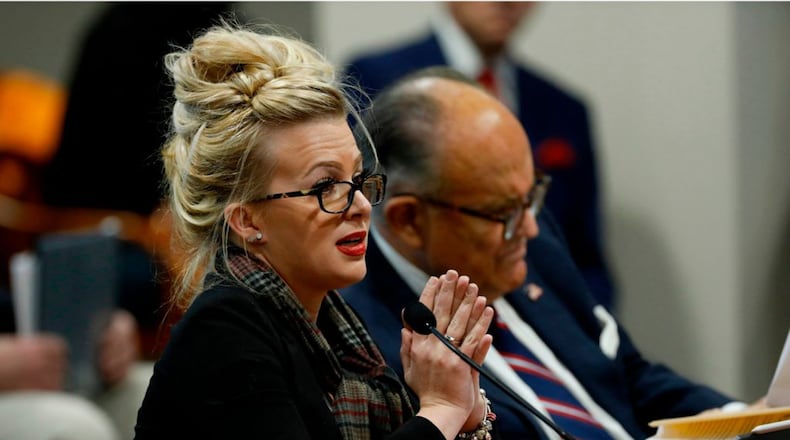 Mellissa Carone, who was working for Dominion Voting Services, speaks in front of the Michigan House Oversight Committee in Lansing, Michigan. The president's attorneys, led by Rudy Giuliani, have made numerous unsubstantiated allegations of election fraud.