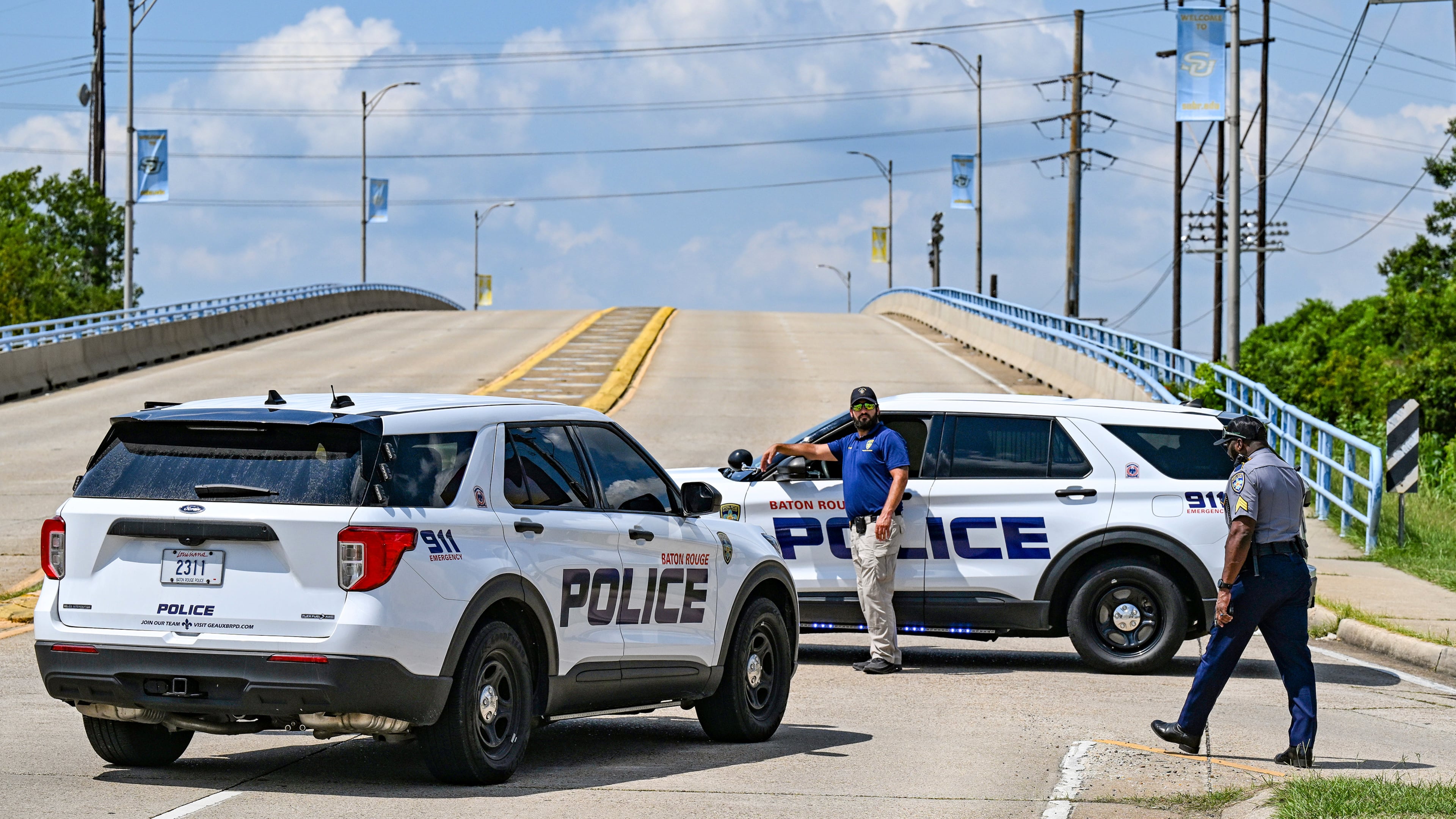 Baton Rouge Police block the entrance of Southern University's campus at the corner of Harding Boulevard and Scenic Highway, Thursday, Sept. 11, 2025, after a threat led administers to announce a lockdown, in Baton Rouge, La. (Javier Gallegos/The Advocate via AP)