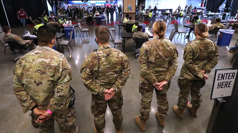 032321 Atlanta: Some of the 222 U.S. Army troops gear up at Mercedes-Benz Stadium as operations get under way for the facility to become the largest Community Vaccination Center in the southeast serving an average of 42,000 citizens a week on Tuesday, March 23, 2021, in Atlanta. There are 202 soldiers from Fort Stewart and twenty U.S. Army medical specialists that will operate some of the vaccination areas located inside Mercedes-Benz Stadium. “Curtis Compton / Curtis.Compton@ajc.com”