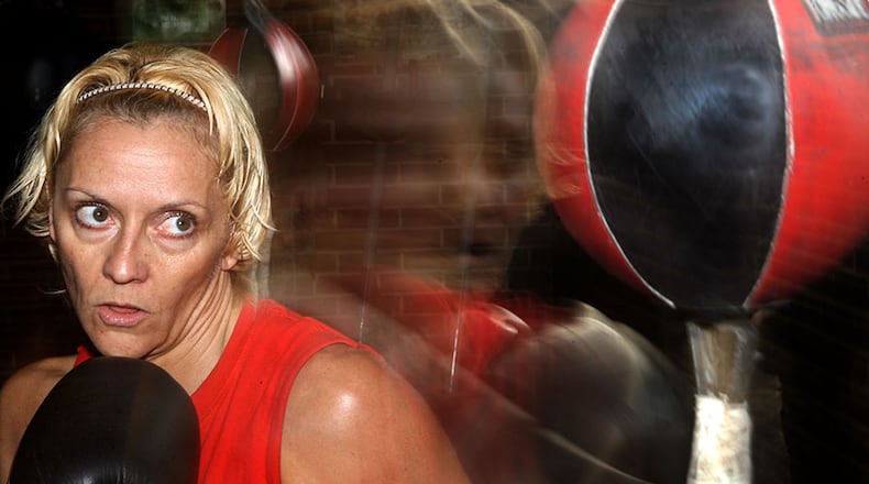 One-time world title straw weight and mini flyweight intercontenental champion, Terri Moss trains in 2007 at the Decatur Boxing Club.