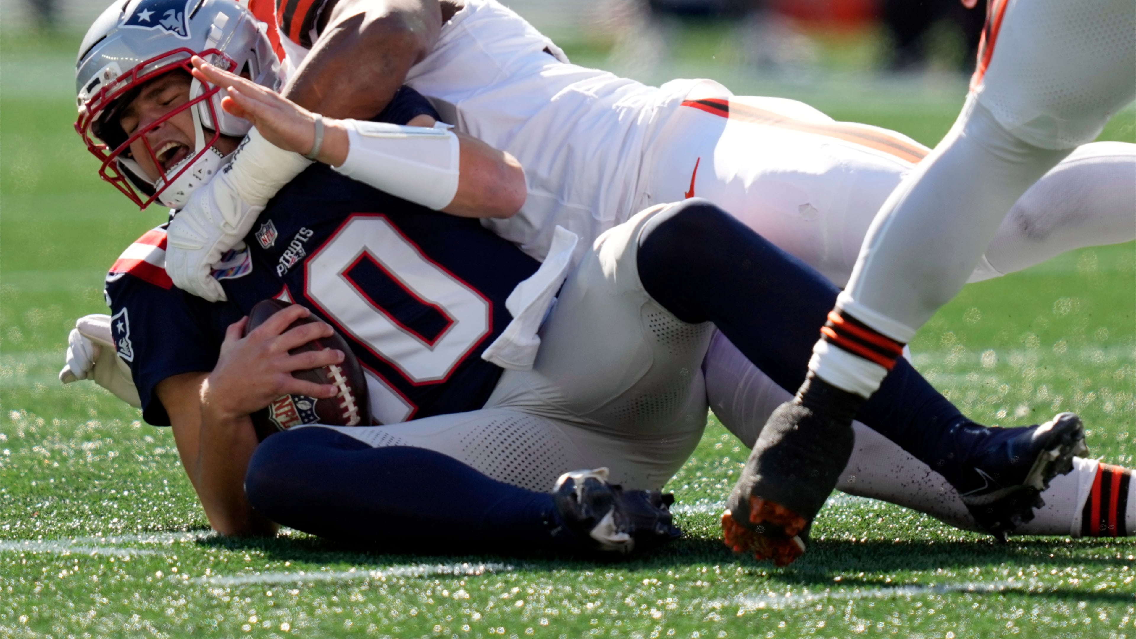 New England Patriots quarterback Drake Maye (10) is sacked by Cleveland Browns defensive end Myles Garrett in the first half of an NFL football game on Sunday, Oct. 26, 2025, in Foxborough, Mass. (AP Photo/Charles Krupa)