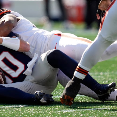 New England Patriots quarterback Drake Maye (10) is sacked by Cleveland Browns defensive end Myles Garrett in the first half of an NFL football game on Sunday, Oct. 26, 2025, in Foxborough, Mass. (AP Photo/Charles Krupa)