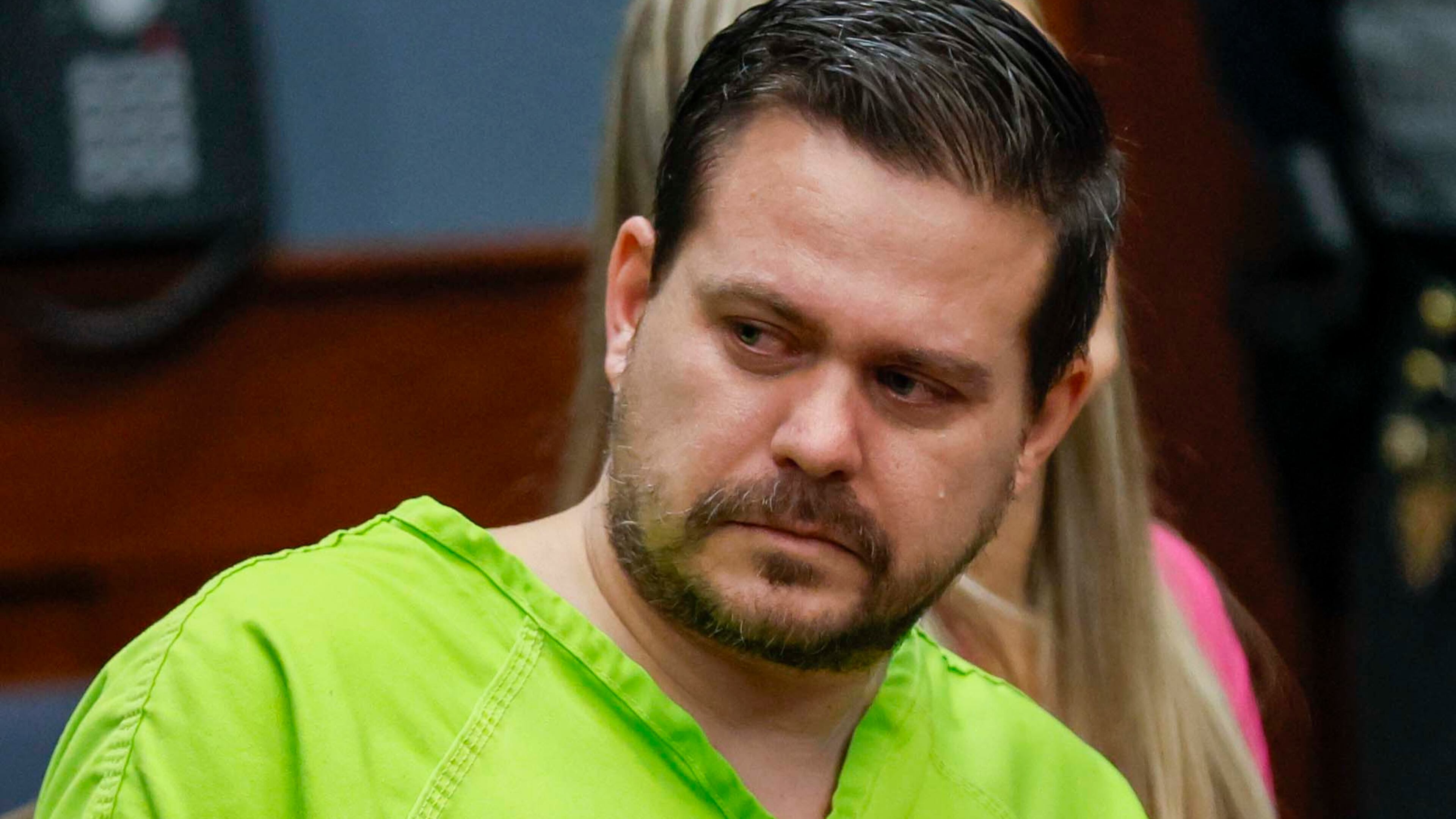 Anthony “AJ” Scott looks at the family members of the two teenagers who died in a 2015 crash during his sentencing hearing at the Carroll County courthouse on Wednesday, Oct. 1, 2025. The former Georgia State Patrol trooper received a 20-year sentence. (Miguel Martinez/AJC)