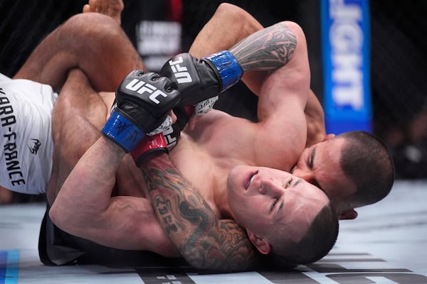 Alexandre Pantoja, right, fights Kai Kara-France in a flyweight title fight at UFC 317, Saturday, June 28, 2025, in Las Vegas. (AP Photo/John Locher)
