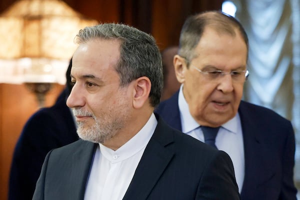 Iranian Foreign Minister Abbas Araghchi, left, and Russian Foreign Minister Sergey Lavrov enter a hall prior to their meeting in Moscow, Russia, Friday, April 18, 2025. (Tatyana Makeyeva/Pool Photo via AP)