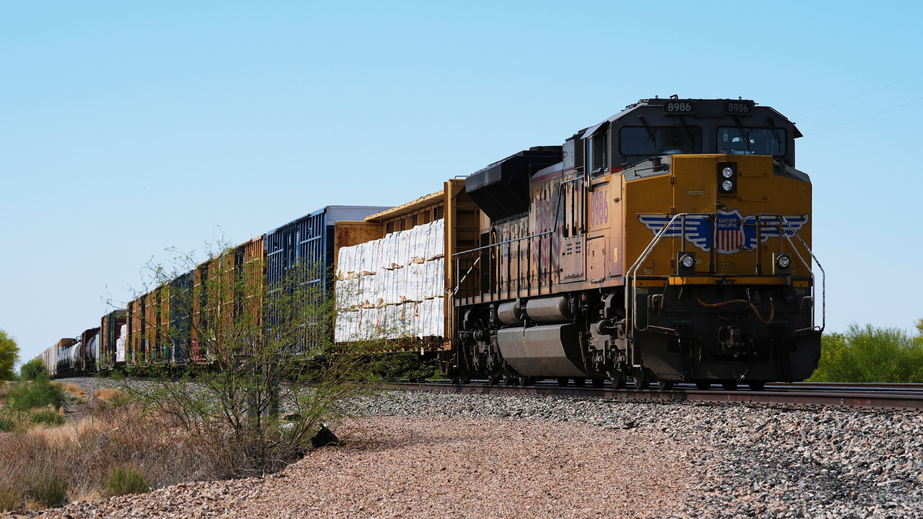 FILE - A Union Pacific freight train idles on the track as it waits to continue moving, Thursday, April 17, 2025, in Red Rock, Ariz. (AP Photo/Ross D. Franklin, File)