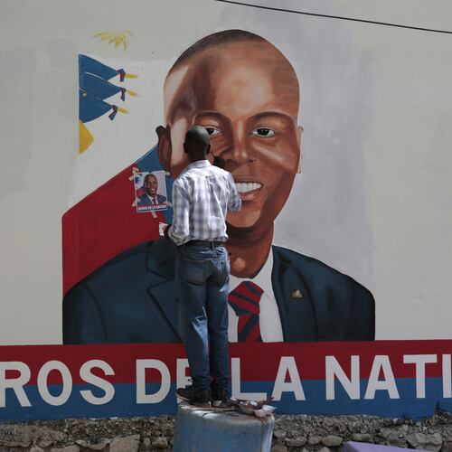 FILE - Artists paint a portrait of slain Haitian President Jovenel Moise near the presidencial residence where he was assassinated two years ago in the Petion-ville area of Port-au-Prince, Haiti, July 7, 2023. (AP Photo/Odelyn Joseph, File)