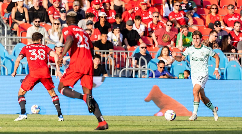 Atlanta United defender Aidan Mcfadden dribbles the ball during the first half of the match against Toronto FC at BMO Field in Toronto, Canada on Saturday June 25, 2022. (Photo by Dakota Williams/Atlanta United)