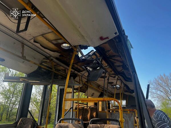 In this photo provided by the Ukrainian Emergency Service, a damaged bus that was hit by the Russian drone in Marhanets, Dnipropetrovsk region, Wednesday, April 23, 2025. (Ukrainian Emergency Service via AP)