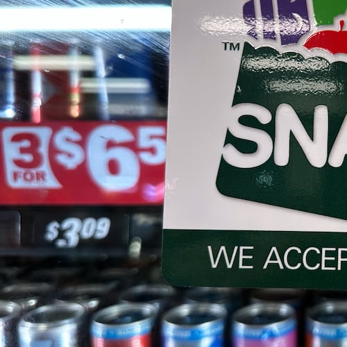 FILE - A SNAP EBT information sign is displayed at a gas station in Riverwoods, Ill., Nov. 1, 2025. (AP Photo/Nam Y. Huh, File)