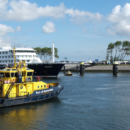 The MV Hondius cruise ship, center, arrives at the Port of Rotterdam, Netherlands, Monday, May 18, 2026. (AP Photo/Patrick Post)