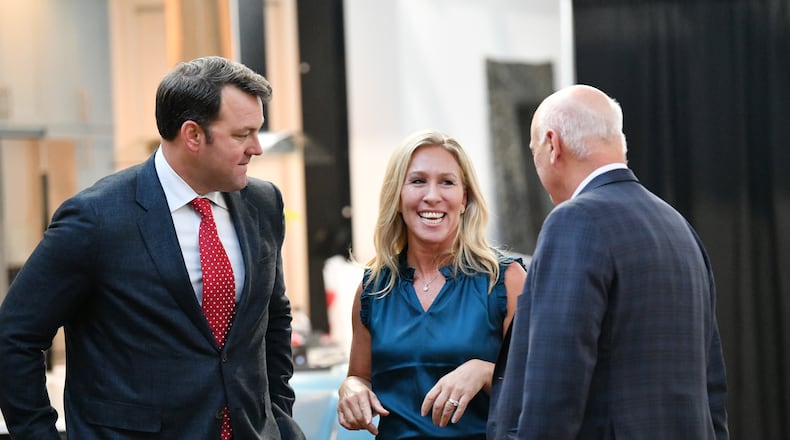 U.S. Rep. Marjorie Taylor Greene speaks with state Sens. Burt Jones (left) and Brandon Beach during a "2020 Election Integrity Townhall" meeting Tuesday in Rome. (Hyosub Shin / Hyosub.Shin@ajc.com)
