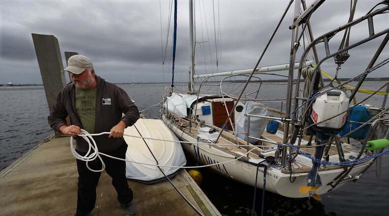 Dana Burchatz, 57, secures his 34-foot Morgan sailboat he recently purchased to the dock at Lang’s Marina hoping for the best while preparing for Hurricane Ian on Wednesday, Sept. 28, 2022, in St. Mary’s. Curtis Compton / Curtis Compton@ajc.com
