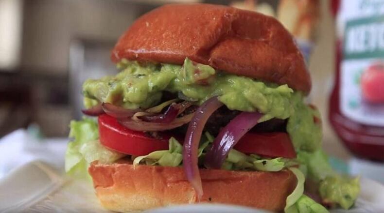 Homemade black bean burgers with local and fresh toppings. (Aleksandra Konstantinovic/Fresno Bee/TNS)
