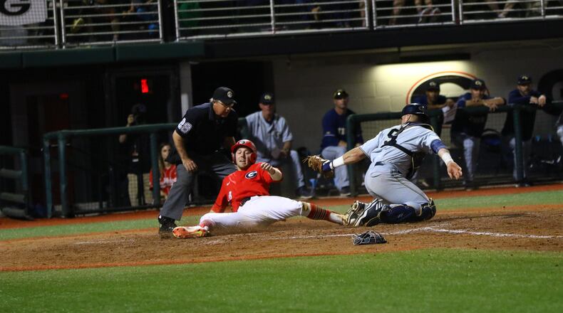 Georgia outfielder Tucker Bradley (28) is thrown out at home in the seventh inning of the Bulldogs' game against Georgia Tech at Foley Field in Athens, Ga. on Tuesday, April 3, 2018.