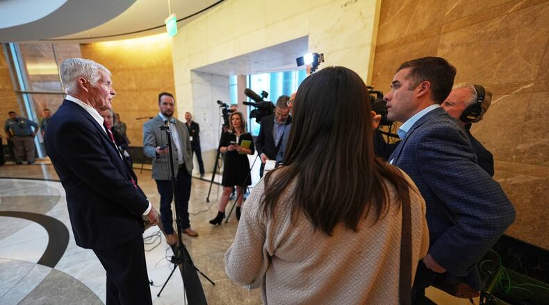 Attorney John Case, left, talks to reporters after a hearing to urge a state appeals court to overturn the convictions against former Colorado elections clerk and Donald Trump ally Tina Peters for orchestrating a data breach of her county's elections equipment Wednesday, Jan. 14, 2026, in Denver. (AP Photo/David Zalubowski)