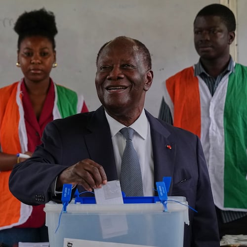 Ivory Coast President Alassane Ouattara casts his vote at a polling station during the presidential elections in Abidjan, Ivory Coast, Saturday, Oct. 25, 2025. (AP Photo/Misper Apawu)