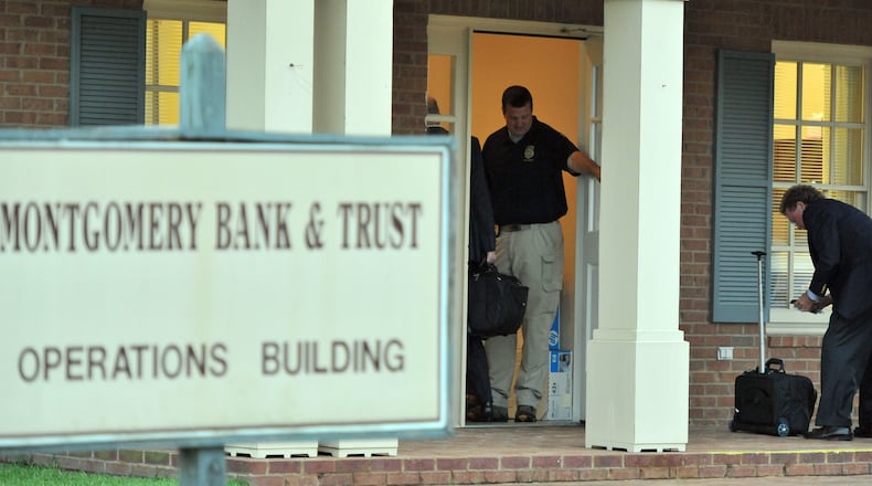 July 6, 2012 Ailey - Federal and state officials enter Montgomery Bank & Trust in Ailey to close the bank on Friday, July 6, 2012. On July 6 2012, Montgomery Bank & Trust in Ailey was closed by the Georgia Department of Banking and Finance. The Federal Deposit Insurance Corporation (FDIC) was then named Receiver. HYOSUB SHIN / HSHIN@AJC.COM