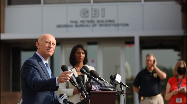 GBI Director Vic Reynolds, left, and Cobb District Attorney Joyette Homes. Miguel Martinez for the Atlanta Journal-Cinstitution