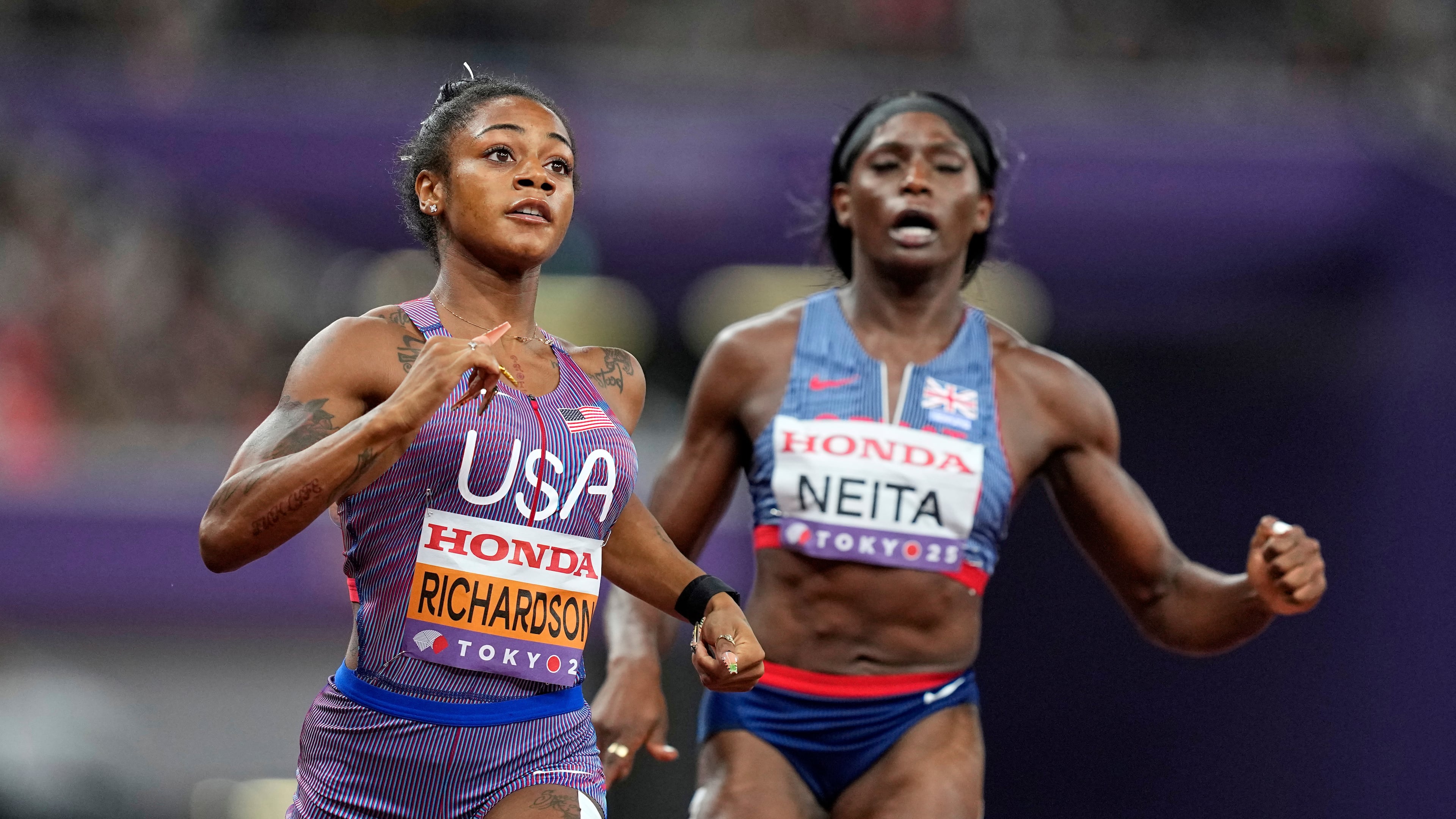 United States' Sha'Carri Richardson and Britain's Daryll Neita finish a women's 100 meters semifinal at the World Athletics Championships in Tokyo, Sunday, Sept. 14, 2025. (AP Photo/Petr David Josek)