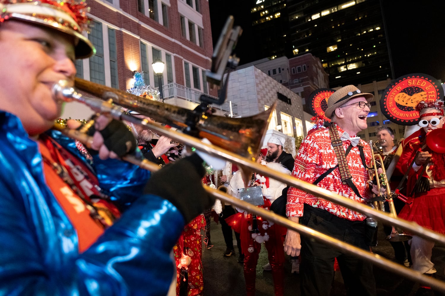 The Seed & Feed Marching Abominable band warms up before the Christmas parade and tree lighting at Atlantic Station in Atlanta on Saturday, Nov. 23, 2024. Ben Gray for the Atlanta Journal-Constitution