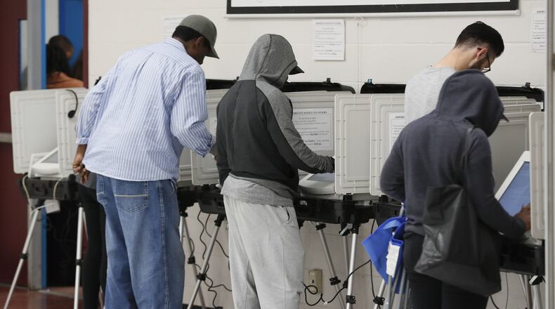 Not all of the voting machines were working at Pittman Park. The wait time to vote at the Pittman Park precinct in Atlanta was reported to be three hours. Pizza and snacks were donated for the people waiting in line. BOB ANDRES / BANDRES@AJC.COM