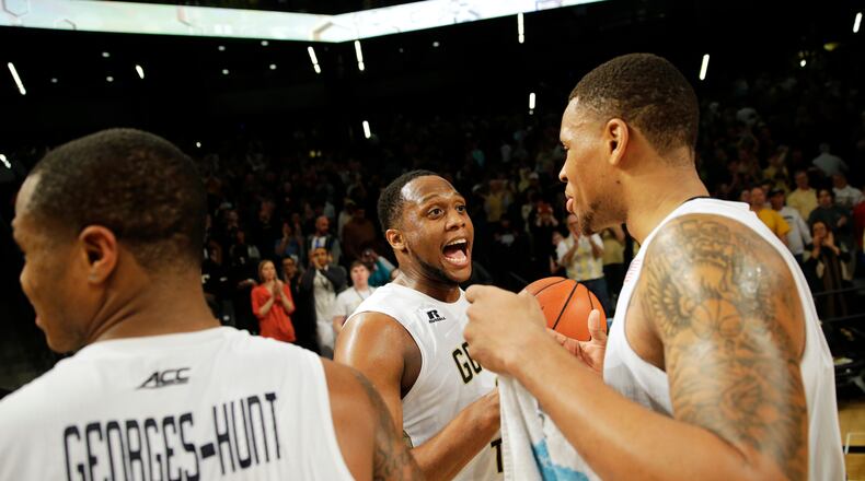 Georgia Tech's Nick Jacobs, right, celebrates with teammate Charles Mitchell after Tech beat Pittsburgh 63-59 in an NCAA college basketball game Saturday, March 5, 2016, in Atlanta. (AP Photo/David Goldman)