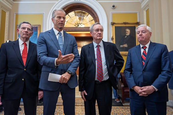 Senate Majority Leader John Thune, R-S.D., center, joined from left by, Sen. John Barrasso, R-Wyo., the GOP whip, Finance Committee Chairman Mike Crapo, R-Idaho, and Budget Committee Chairman Lindsey Graham, R-S.C., speaks to reporters after passage of the budget reconciliation package of President Donald Trump's signature bill of big tax breaks and spending cuts, at the Capitol in Washington, Tuesday, July 1, 2025. (AP Photo/J. Scott Applewhite)
