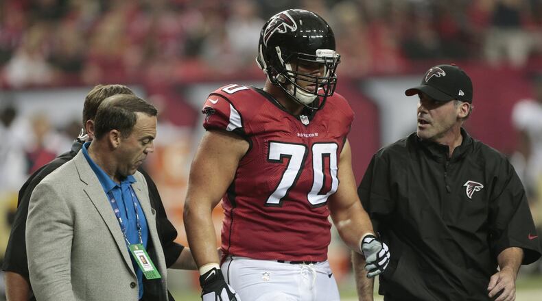 Atlanta Falcons offensive tackle Jake Matthews (70) walks off the field after being injured against the New Orleans Saints during the first half of an NFL football game, Sunday, Sept. 7, 2014, in Atlanta. (AP Photo/John Bazemore)