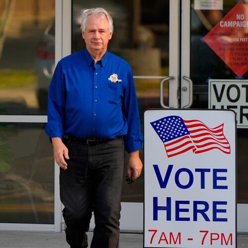 Richard Cullom leaves a voting center after voting, Tuesday, May 19, 2026, in Marietta, Ga. (AP Photo/Mike Stewart)