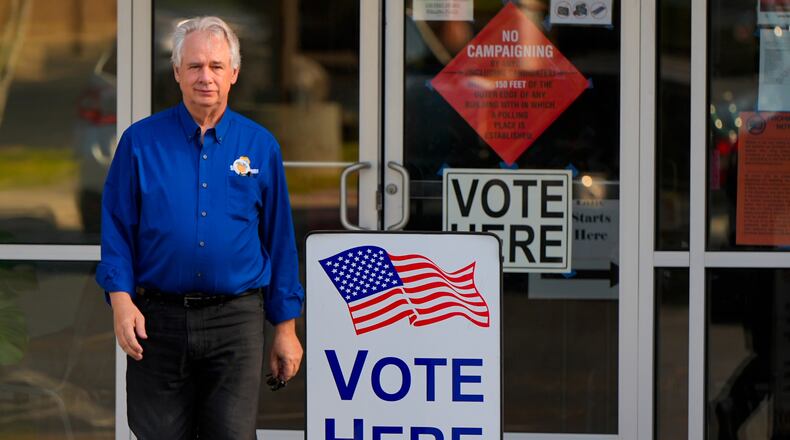 Richard Cullom leaves a voting center after voting, Tuesday, May 19, 2026, in Marietta, Ga. (AP Photo/Mike Stewart)