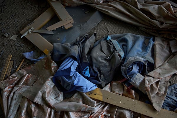 The school uniform lies scattered in a neighbouring house is seen after Indian forces blew up the family home of Ahsan Ul Haq Shiekh, a militant who officials say is involved in the deadly attack on tourists in Pahalgam, at Murran village in Pulwama, south of Srinagar, Indian controlled Kashmir, Saturday, April 26, 2025. (AP Photo/Dar Yasin)