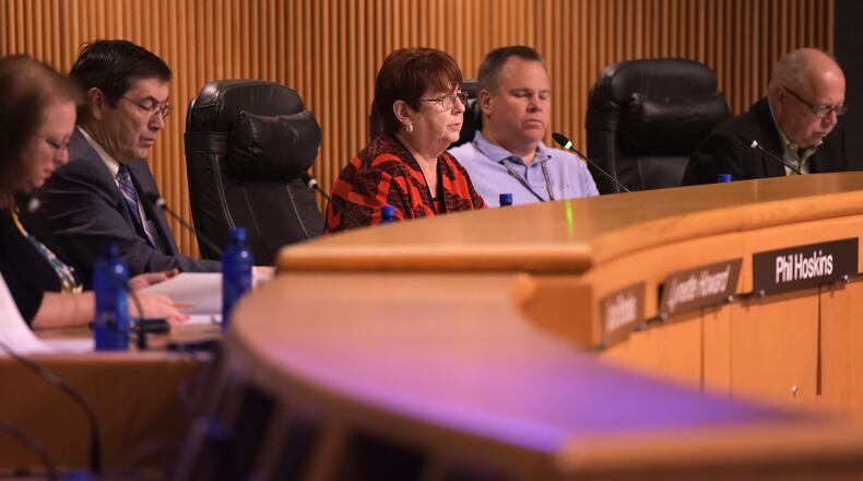 Charlotte Nash, (center) chairman of the Gwinnett County Board of Commissioners, calls for a vote to approve a new contract with MARTA on Wednesday. Jenna Eason, Jenna.Eason@coxinc.com