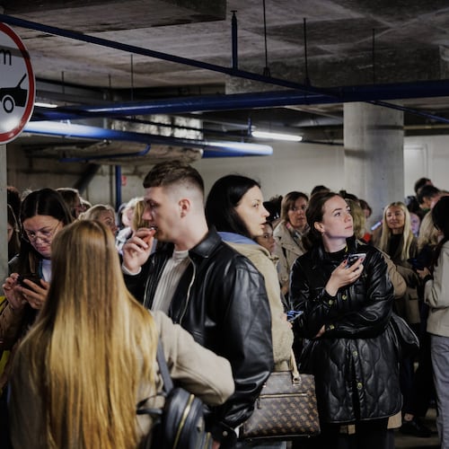 People take shelter in an underground car park during an air raid alert in Vilnius, Lithuania, Wednesday, May 20, 2026. (Vygintas Skaraitis/Lrytas via AP)
