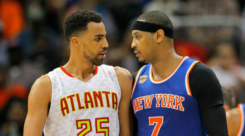 Atlanta Hawks’ Thabo Sefolosha (25) and New York Knicks’ Carmelo Anthony (7) confront each other after a technical foul is called on each of them during the first half of an NBA basketball game on Wednesday, Dec. 28, 2016, in Atlanta. Anthony was ejected from the game. (AP Photo/Todd Kirkland)