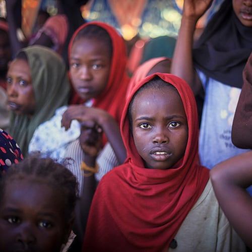 This photo released by The Norwegian Refugee Council (NRC), shows displaced women and children from el-Fasher at a camp where they sought refuge from fighting between government forces and the RSF, in Tawila, Darfur region, Sudan, Monday, Nov. 3, 2025. (Marwan Mohammed/NRC via AP)