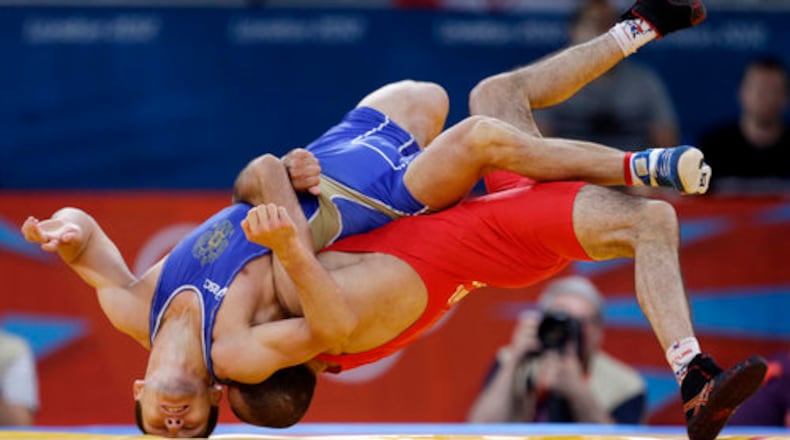 2012 Olympic highlights showing Revaz Lashkhi of the country of Georgia as he wraps up Zaur Kuramagomedov of Russia (in blue) during the 60-kg Greco-Roman wrestling competition. The USA Wrestling team will hold a training camp at The Cooler athletic center in Alpharetta in May. The team is preparing to compete in the Tokyo Summer Olympics which starts July 23.