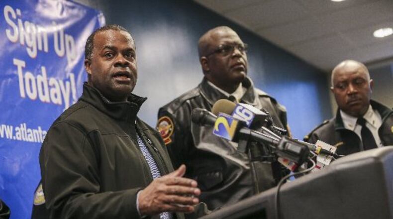 Mayor Kasim Reed (left) talks about preparations for inclement weather at a press conference last January at Atlanta Public Safety headquarters.