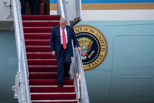 President Donald Trump exits Air Force One at Joint Base Andrews, Md., Wednesday, June 25, 2025. (AP Photo/Cliff Owen)