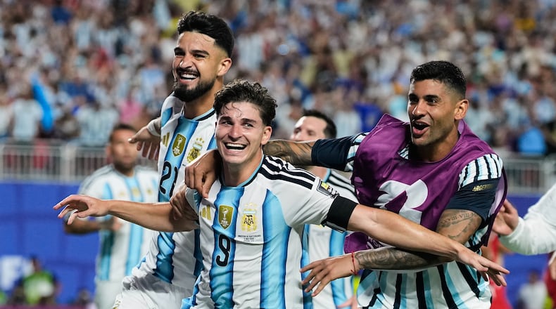 Argentina's Julian Alvarez (9) celebrates after scoring his side's second goal during the World Cup quarterfinal soccer match against Switzerland in Kansas City, Mo., Saturday, July 11, 2026. (AP Photo/Charlie Riedel)